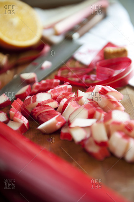 Chopped rhubarb on wooden cutting board