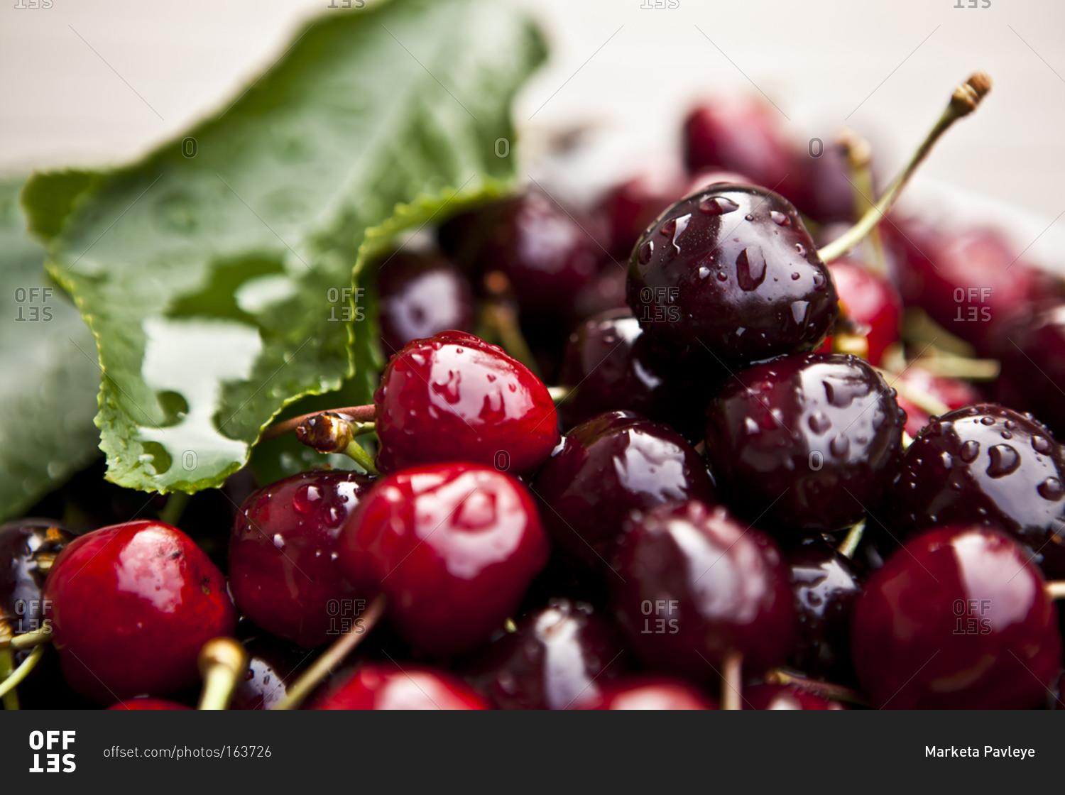 A pile of red cherries