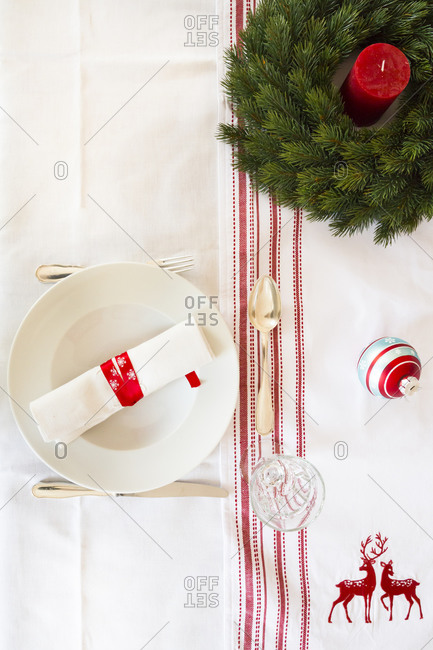 Red-white laid table with Advent wreath at Christmas time