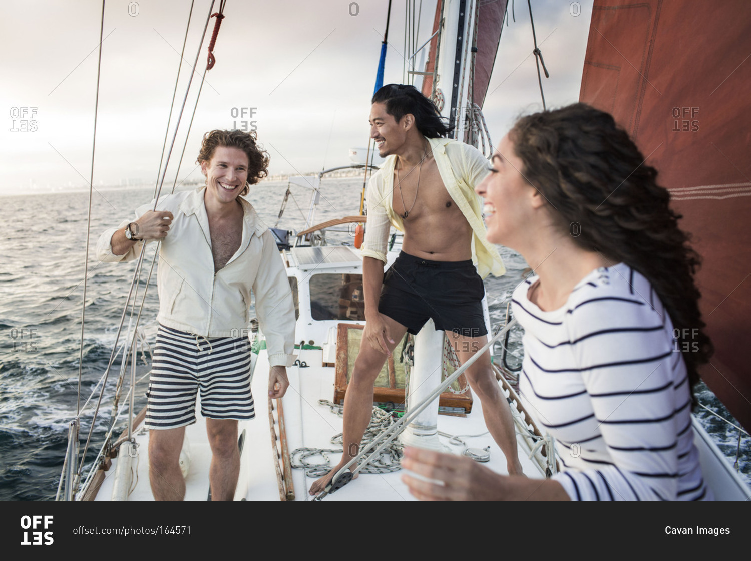 Friends enjoy themselves on a sailboat