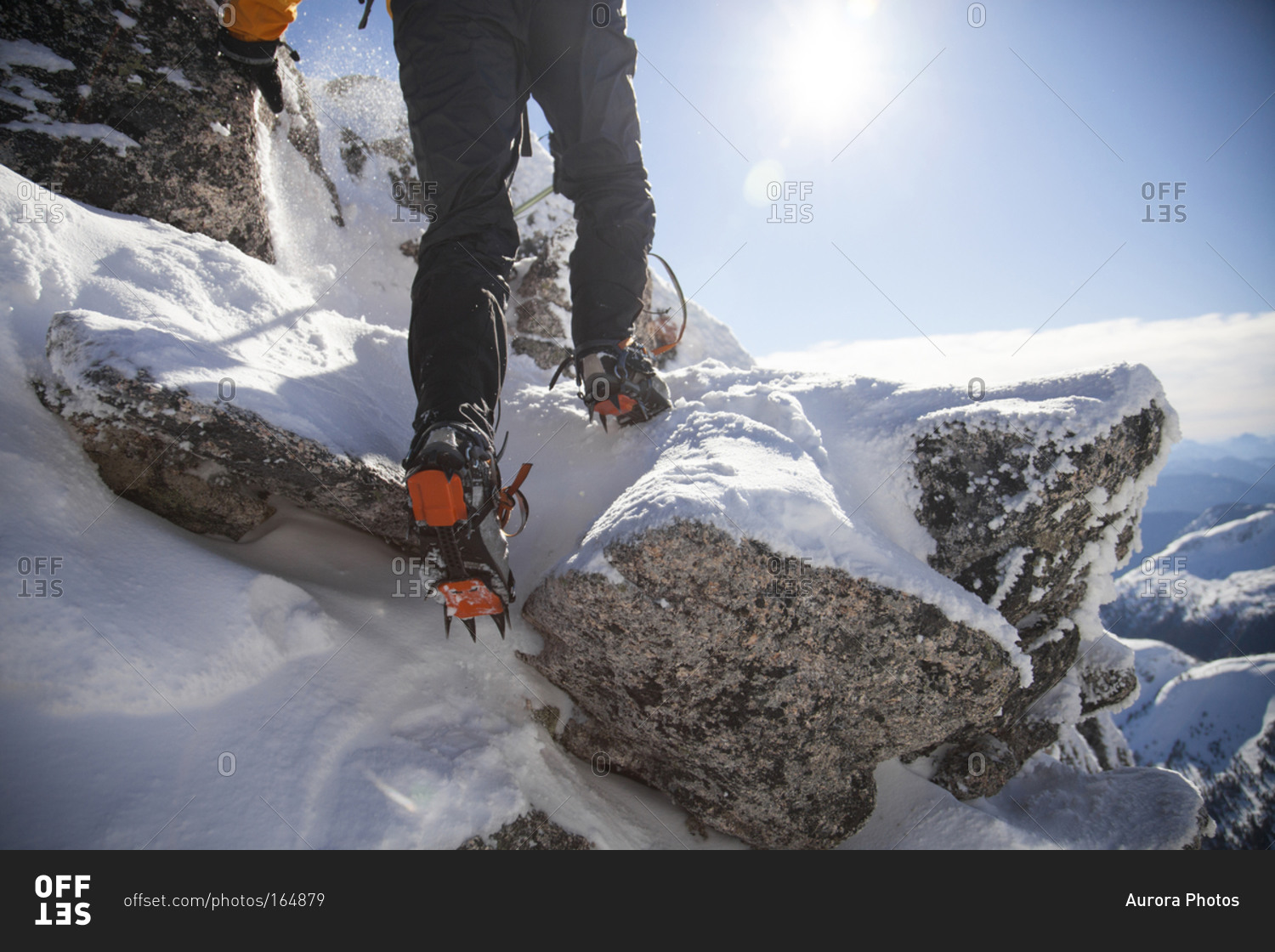 Detail shot of mountain boots with crampons during a climb in the Coquihalla Recreation Area of British Columbia, Canada