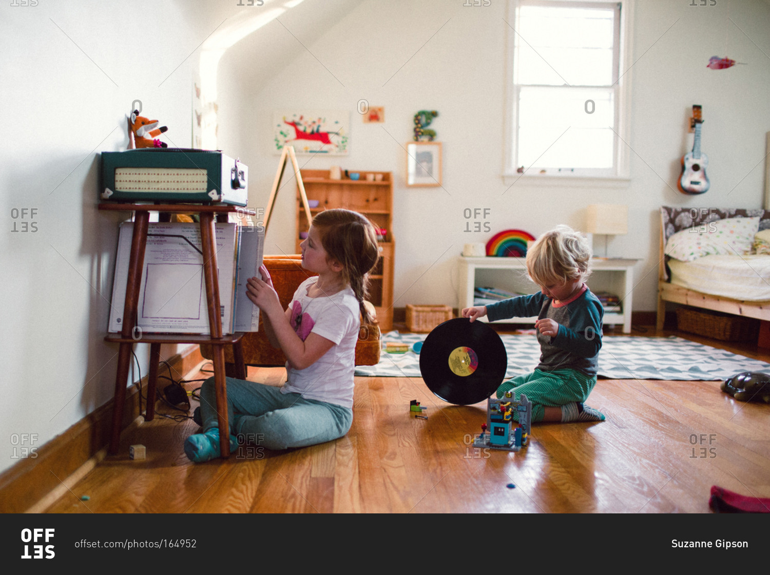 A boy and girl look for records to listen to
