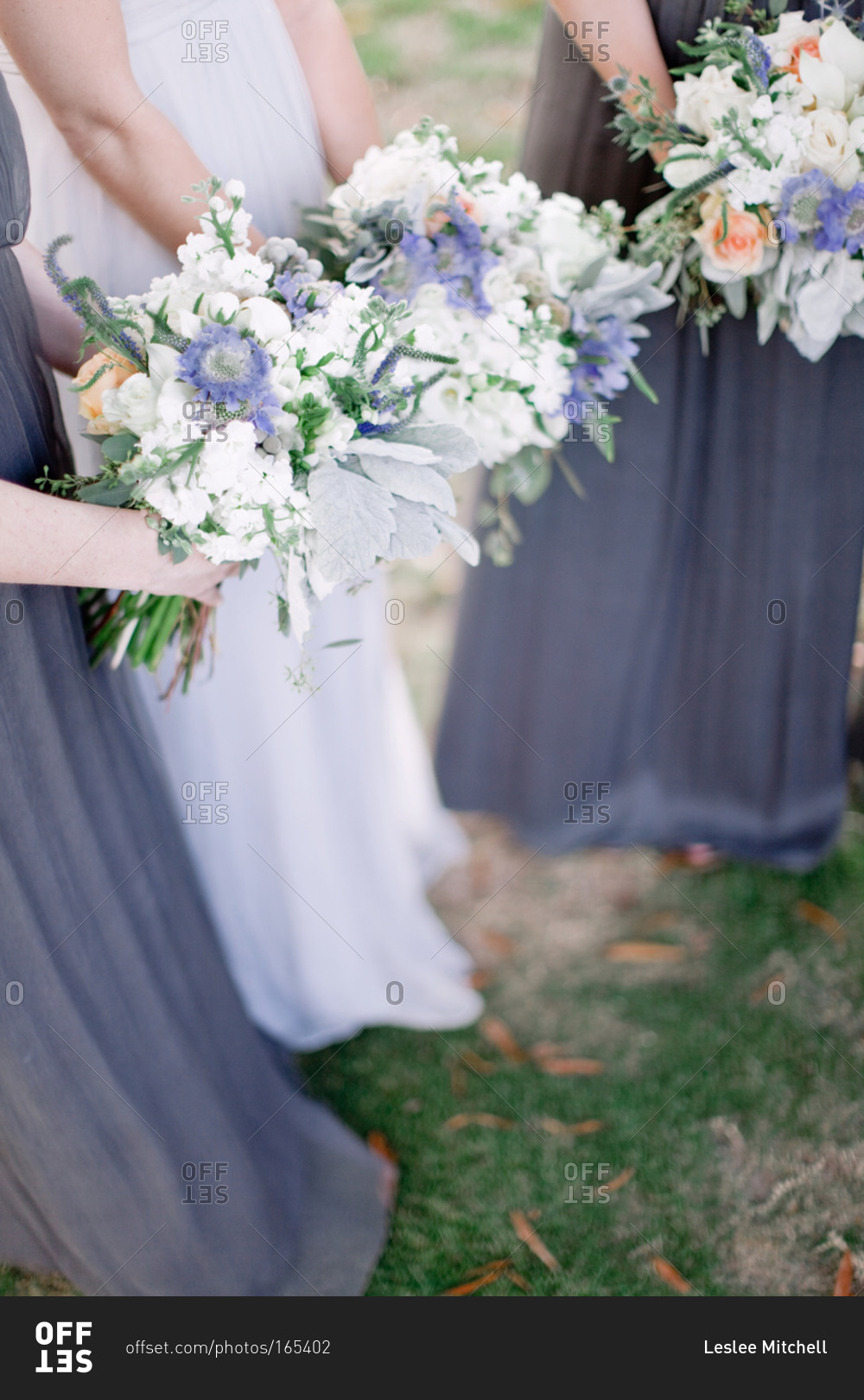 Bridesmaids and brides holding bouquets