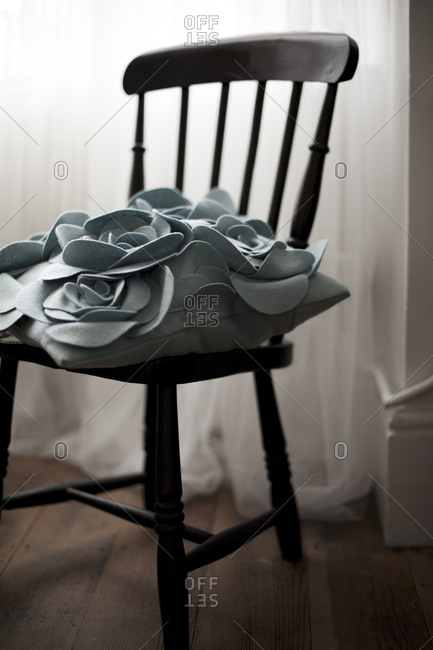 A throw pillow on a chair