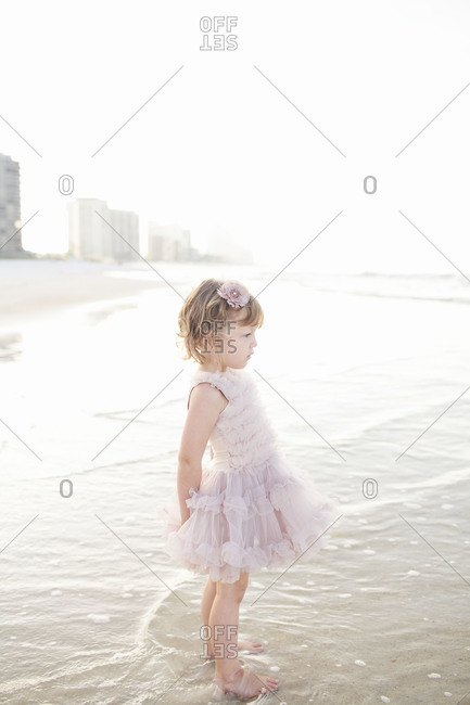 Young girl standing on beach