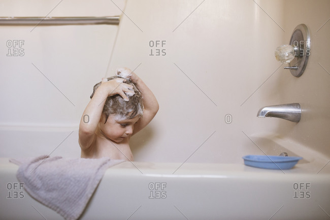 Young Boy Washing His Hair In A Bath, How To Get Hair Off Bathtub