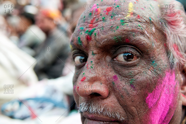 India - March 10, 2014: Close up of a man during Holi Festival in Nadgaon,  India stock photo - OFFSET