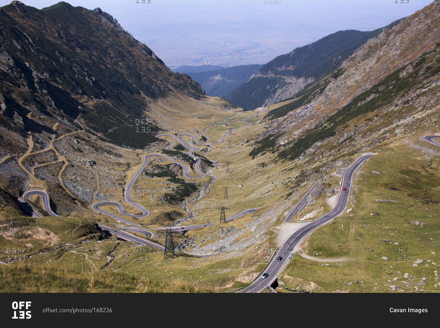 View of valley with serpentine roads stock photo OFFSET