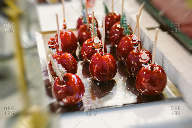 Shiny red candy apples at Christmas Market in France