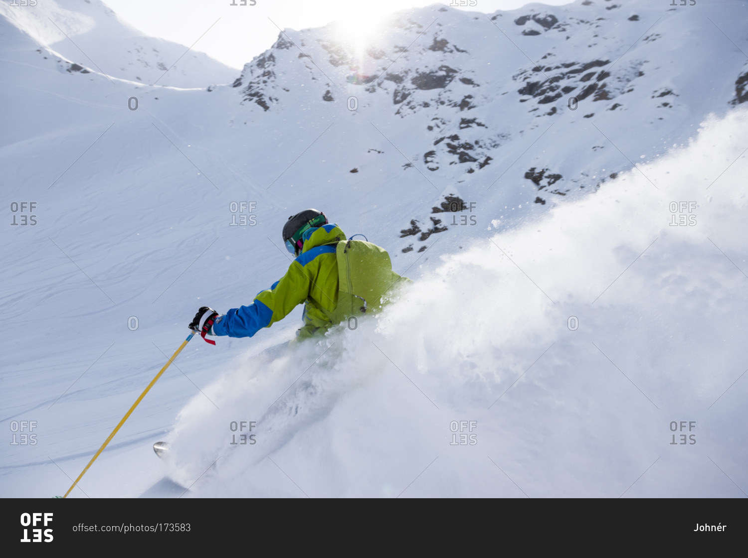 Man backcountry skiing on a snowy slope