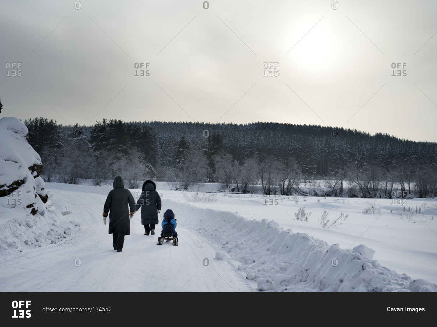 Family walking home after day in snow