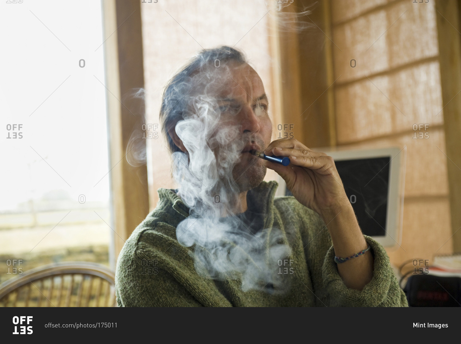 A man using an electronic cigarette