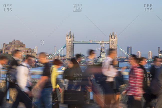 Commuters crossing London Bridge in London