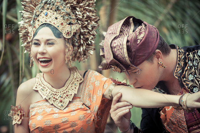 Couple in traditional garb during wedding ceremony in Bali, Indonesia