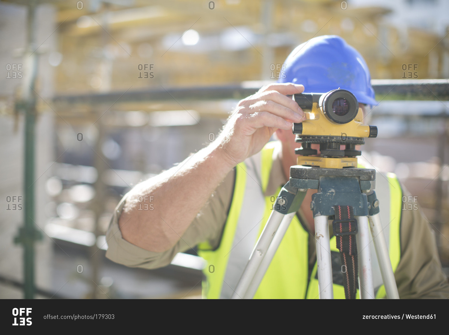Surveyor on construction site Offset stock photo OFFSET