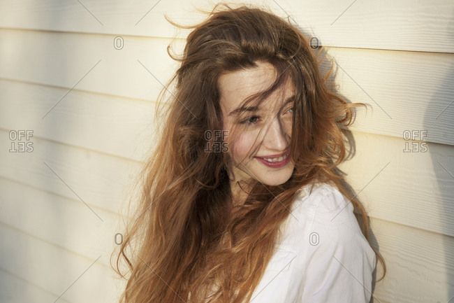 A woman with long windblown hair