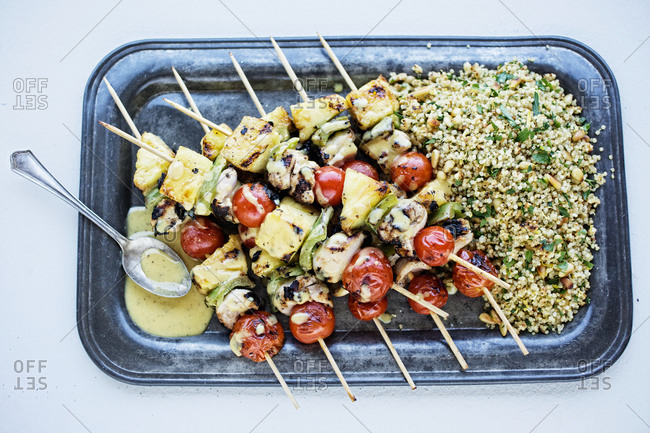 Pineapple chicken skewers with quinoa