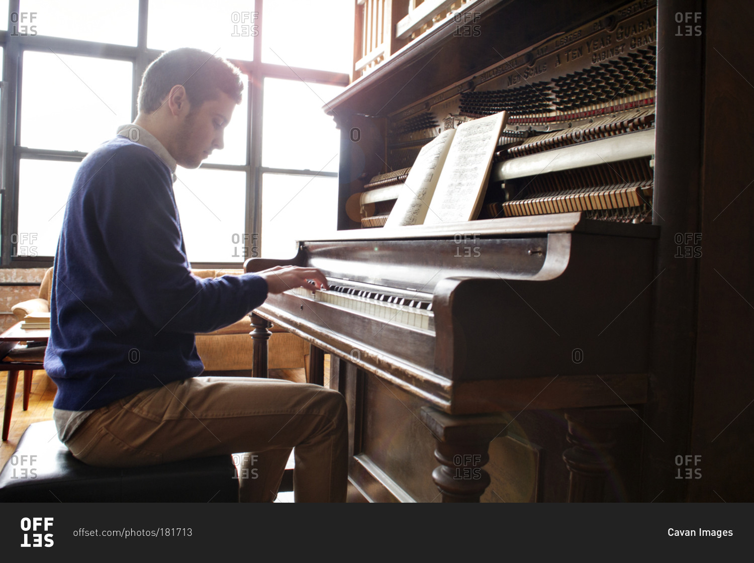 Person Playing Grand Piano