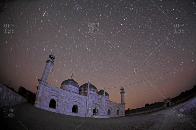 Bahawalpur, Pakistan - January 25, 2012: Starry sky above the mosque by Derawar Fort