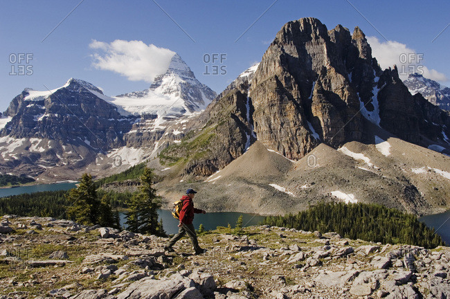 Man Walking by Mountain Lake in the Canadian Rocky Mountains