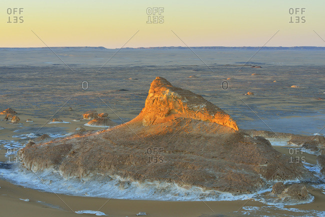Rock formation at sunrise in White Desert, Sahara Desert