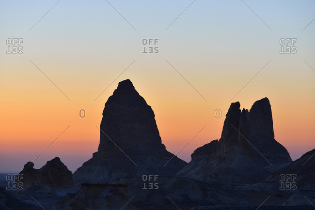 Silhouette of rock formations at dawn in White Desert, Sahara Desert