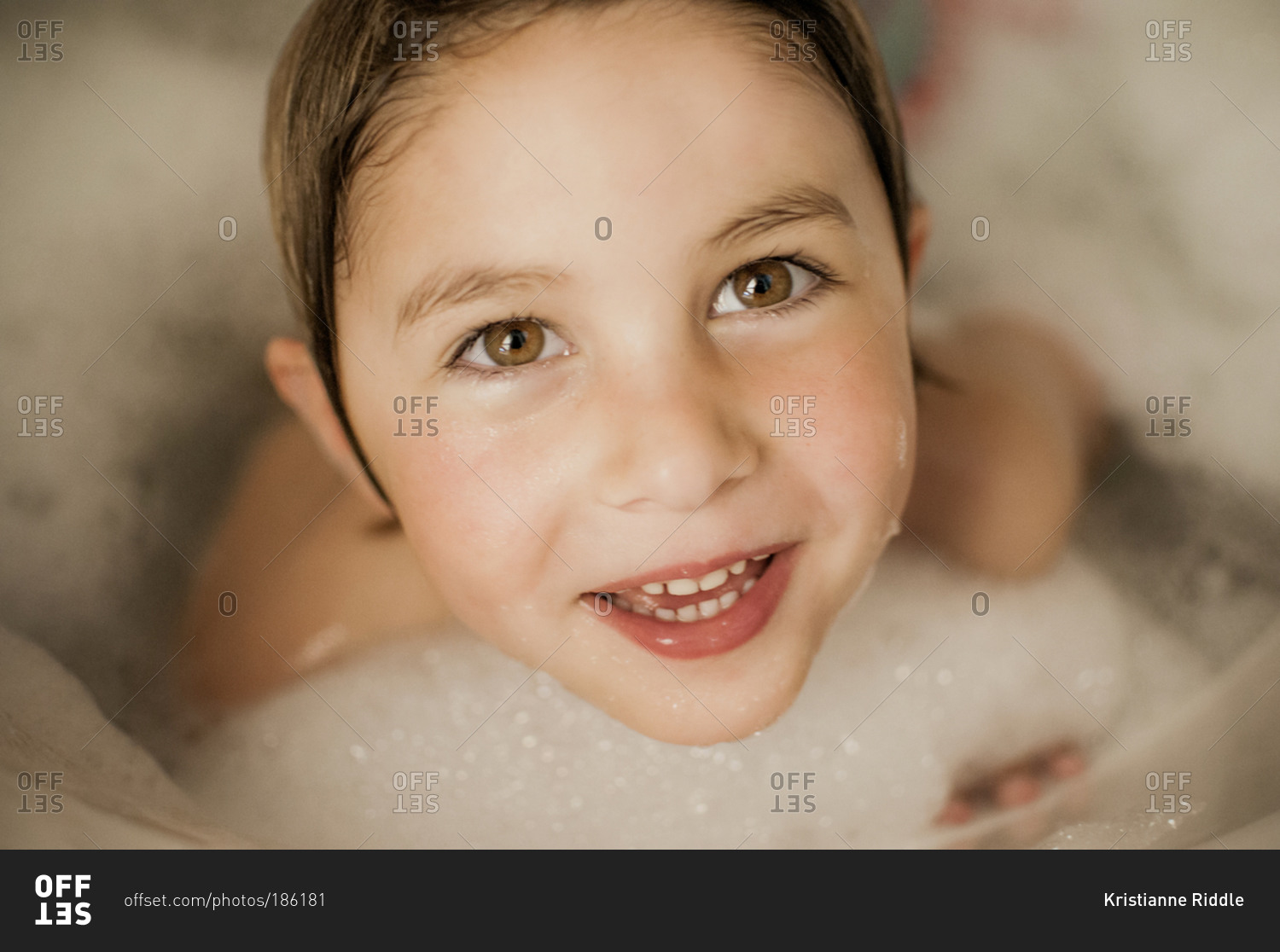 A little girl taking a bubble bath stock photo OFFSET