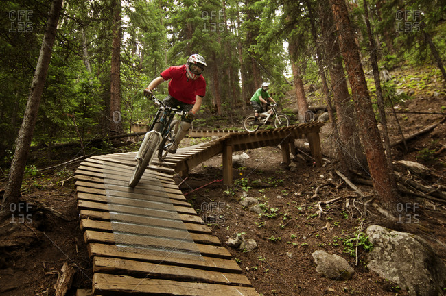 Men riding their bikes on a track