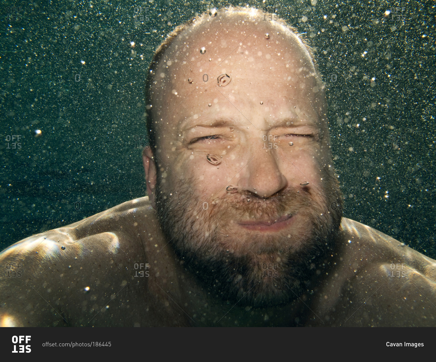 Man holding his breath underwater stock photo OFFSET