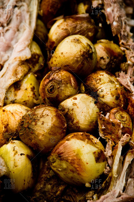 Pig roast stuffed with whole onions
