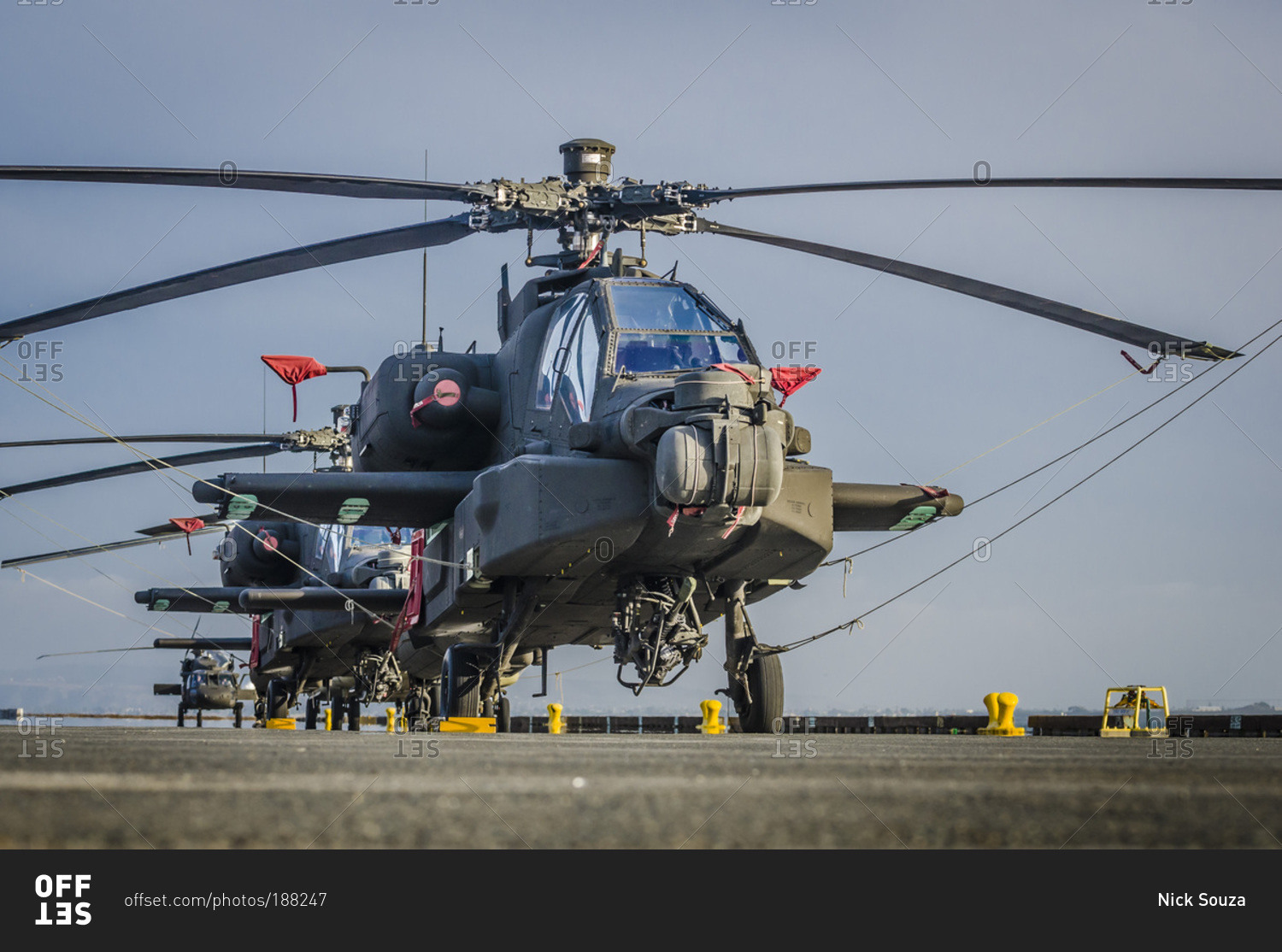 Us Army Apache and Blackhawk helicopters tied down aboard a cargo ship in the Port of San Diego