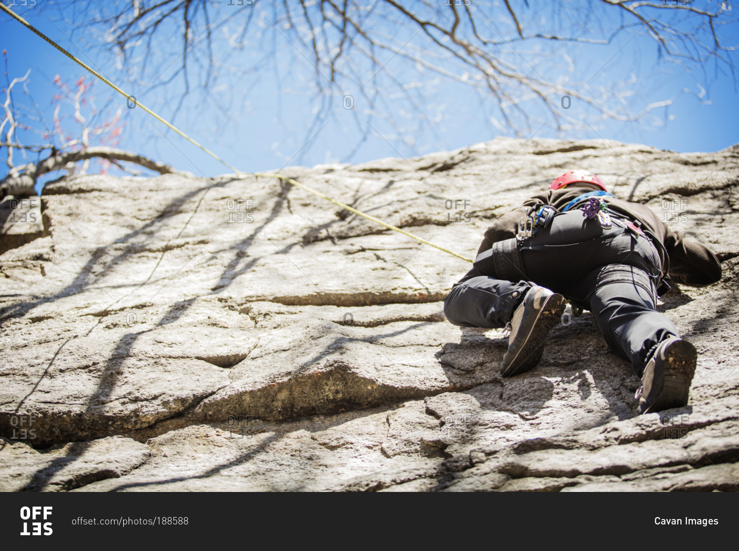 Man climbing down rock