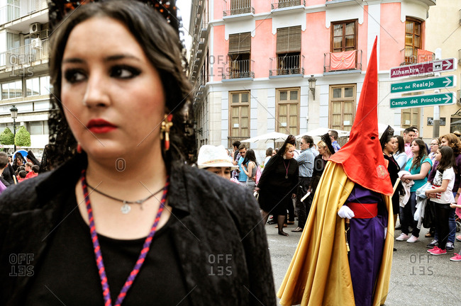 Granada, Spain - April 16, 2014: People at a Holy Week procession in Granada, Spain