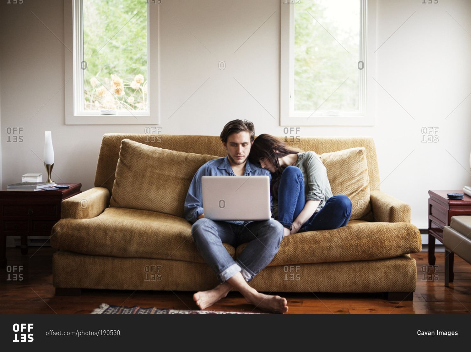 Couple Cuddling On Couch