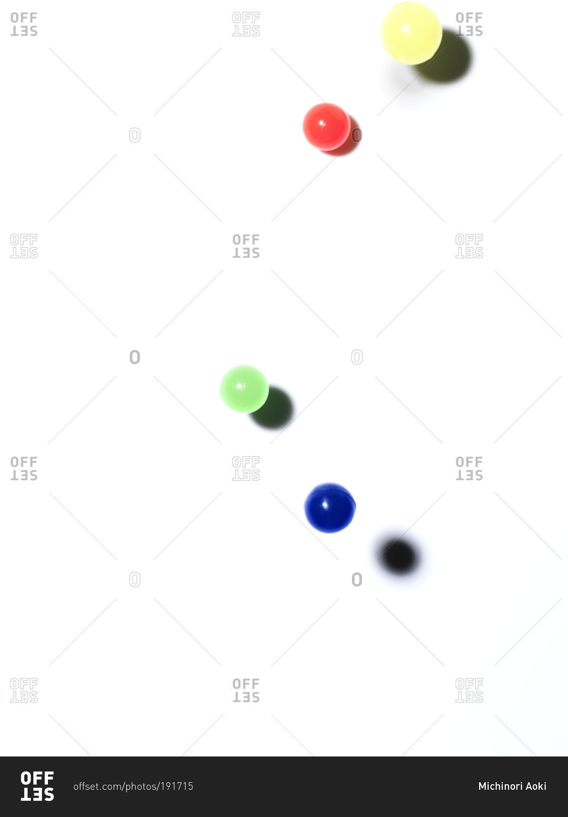 Colorful bouncy balls on white background stock photo - OFFSET