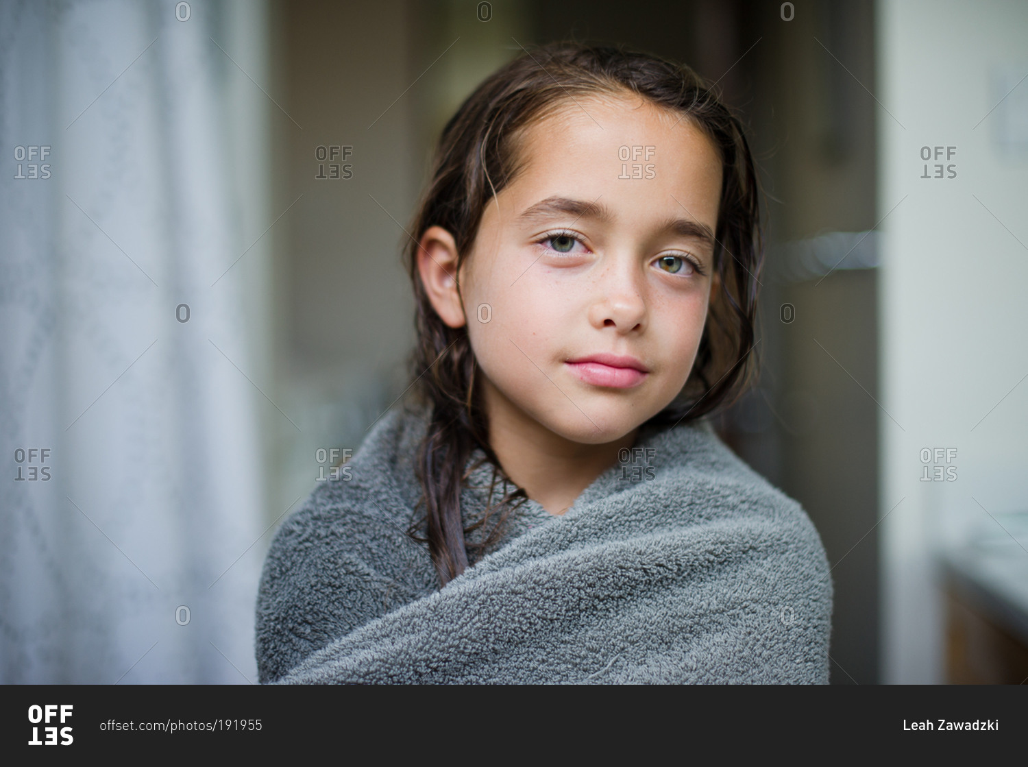 Portrait of young girl with wet hair wrapped in towel stock photo OFFSET