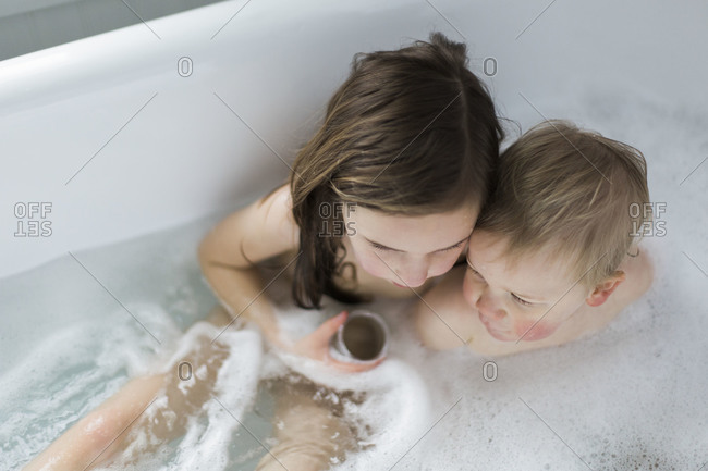 Overhead View Of Two Little Girls In Bathtub Stock Photo