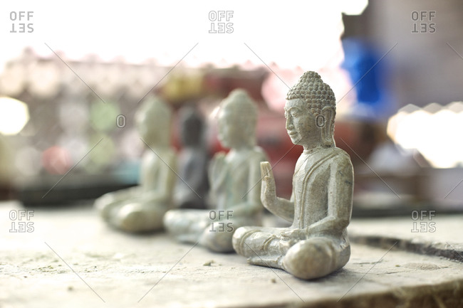 Carved Buddha statuettes in a workshop