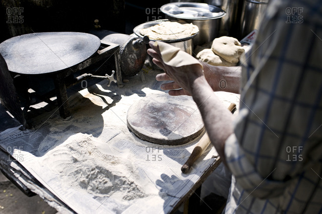 Close up of person making flatbread