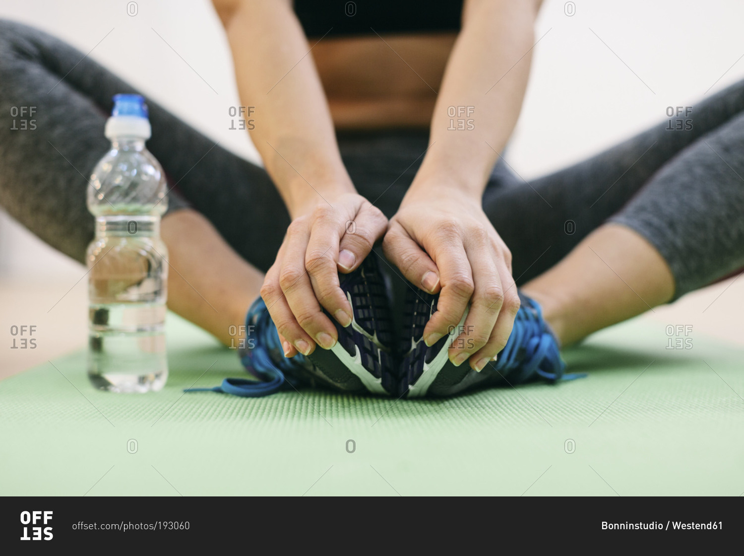 Woman doing fitness workout on gym mat