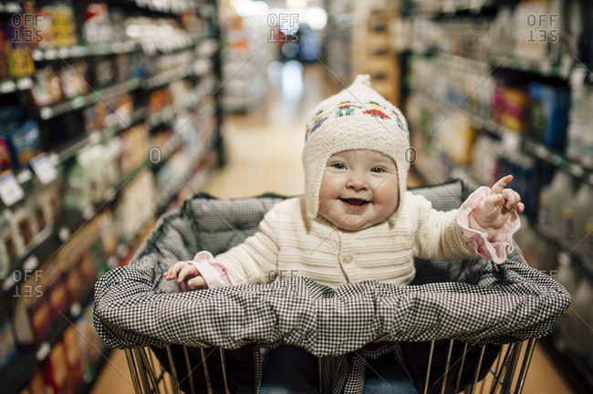 Cute Baby In A Shopping Cart Stock Photo Offset