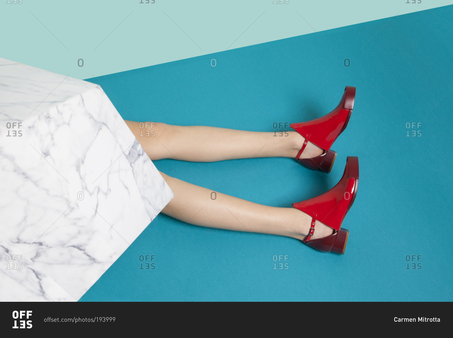 woman-with-red-shoes-lying-on-blue-background-stock-photo-offset