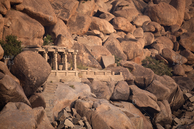 Landscape with temple and granite rocks in Hampi