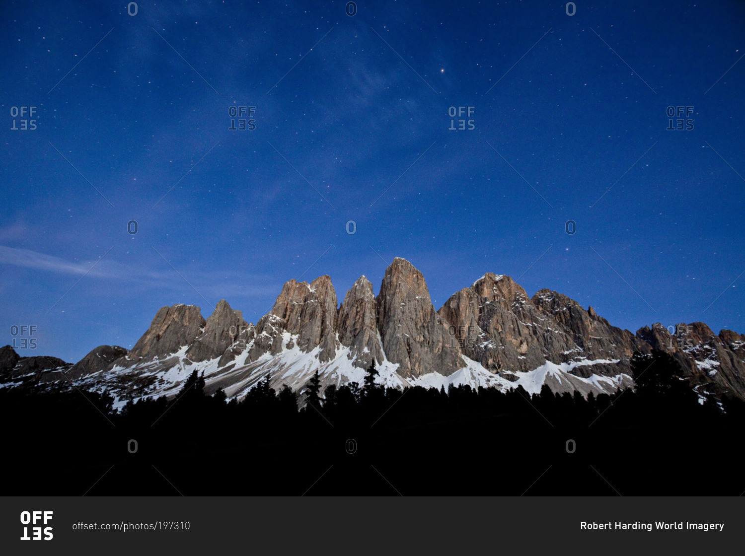 The starry sky above the Odle-Villnoss massif in South Tyrol, Italy
