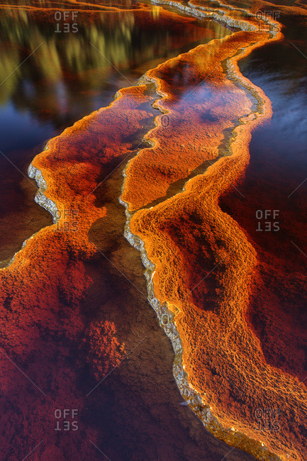 Water reflecting red in the Rio Tinto