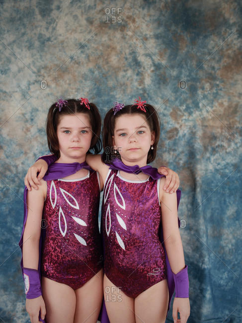 Twinsburg, Ohio - August 4, 2012: Identical twin sisters posing for a portrait during the annual Twins Days Festival