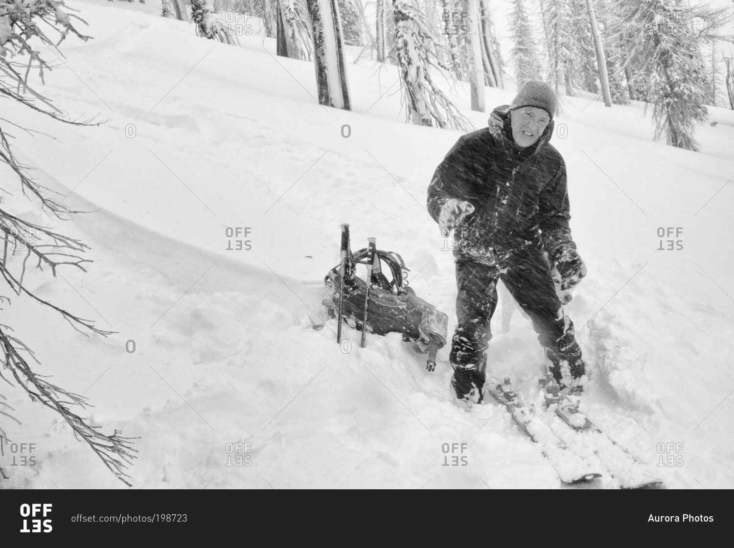 A backcountry skier suffers in blowing wind and cold temperatures during the change over in the Bitterroot Mountains near Victor, Montana