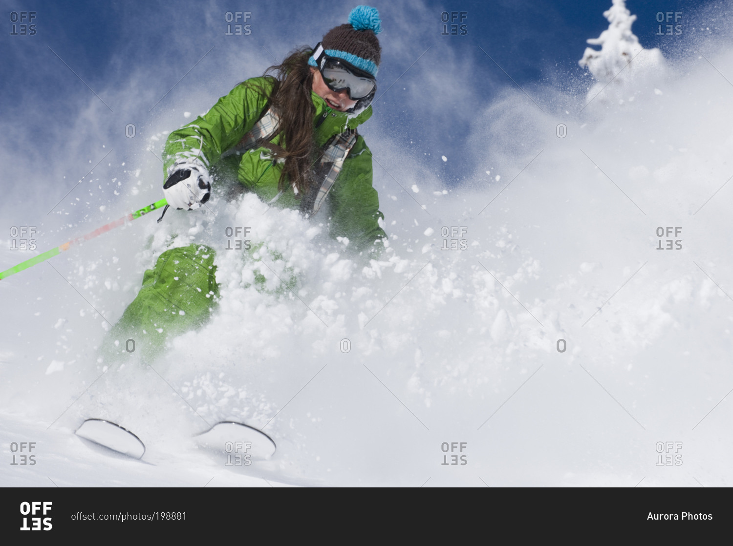 Woman skiing deep powder at Alta, Utah