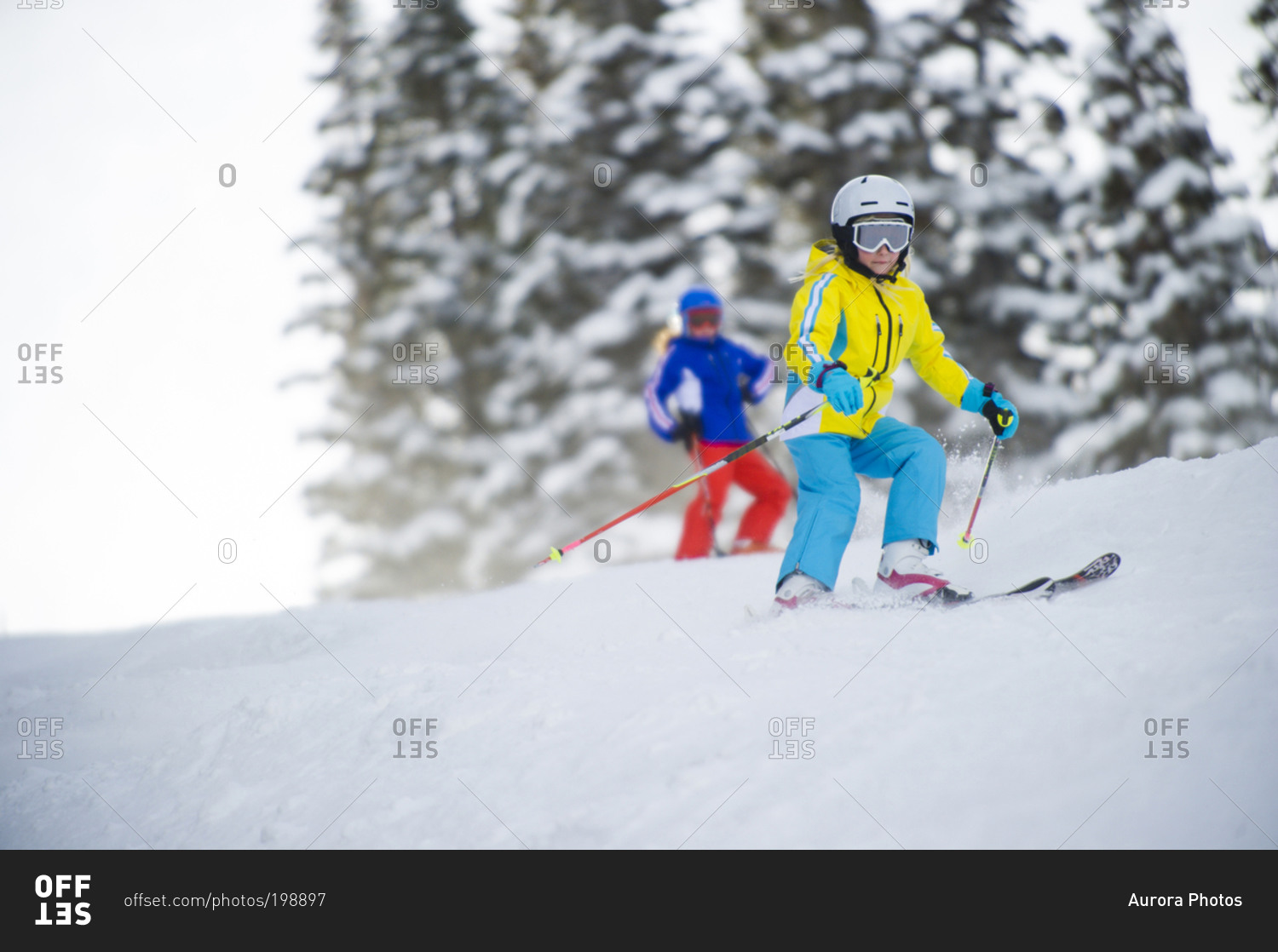 Young girl skiing a groomer