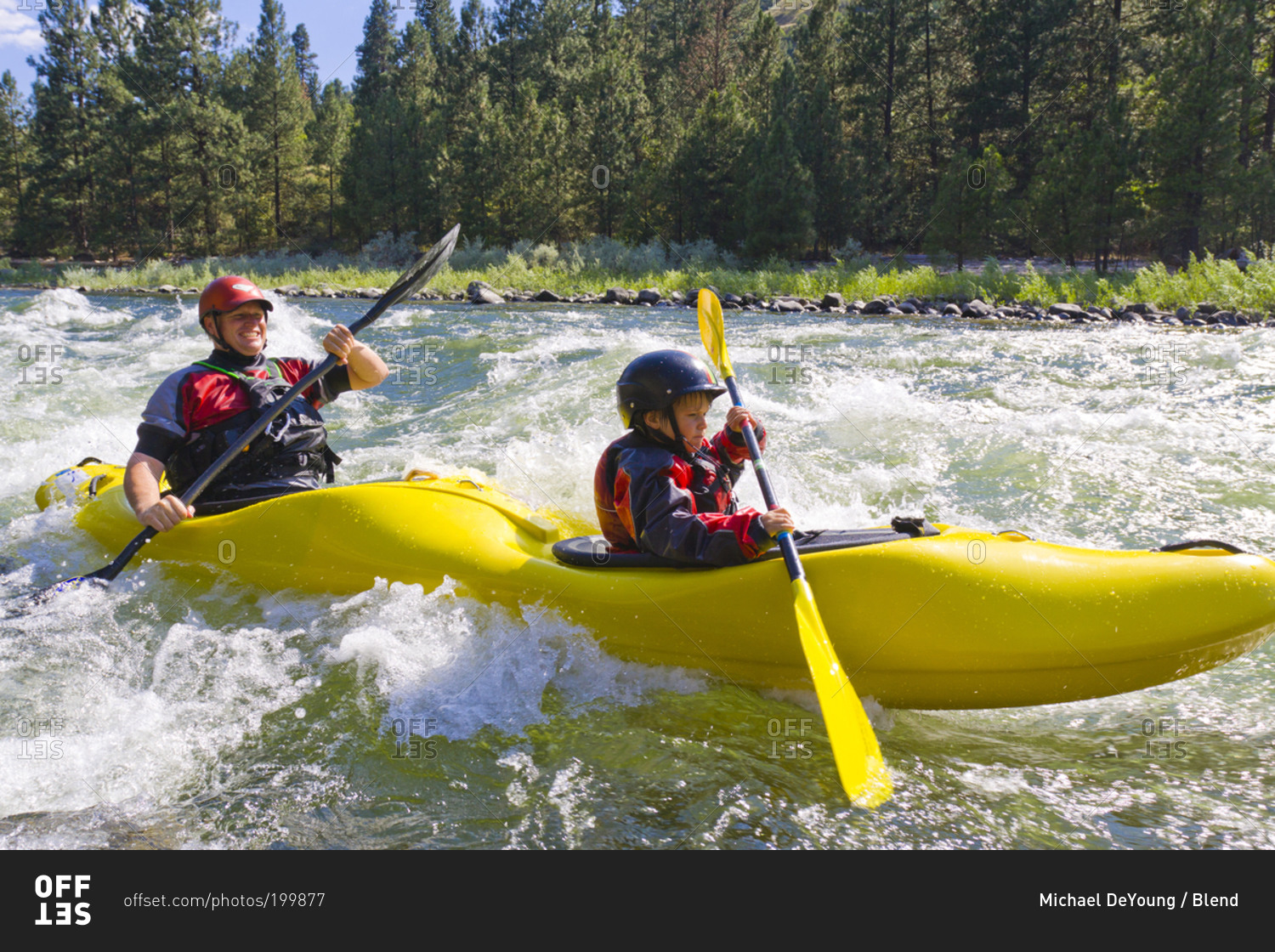 Father and son kayaking in Idaho